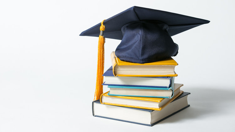 Books and grad cap