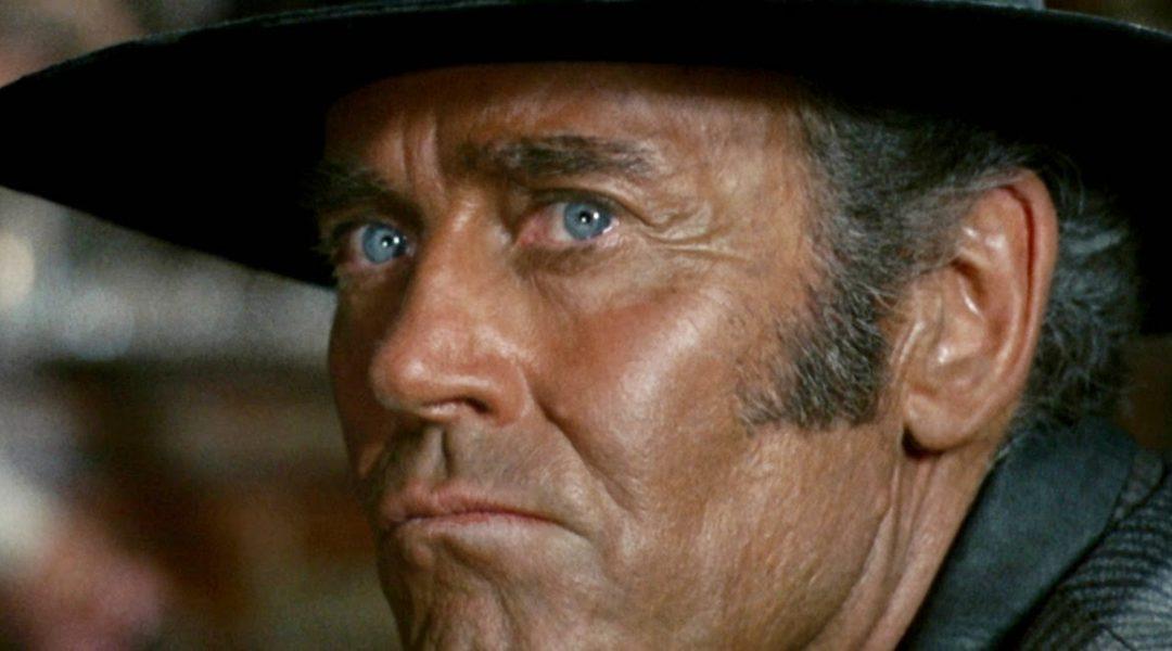 Henry Fonda in Western attire with a concerned look on his face