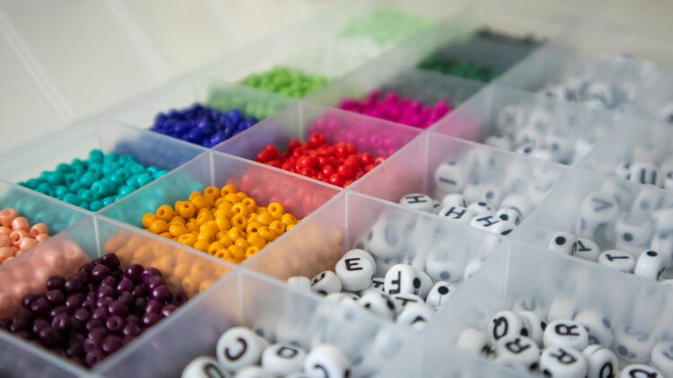 A variety of colorful beads organized by type