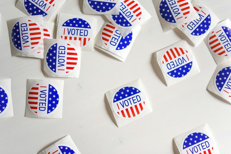 A pile of red, white, and blue 'I Voted' stickers