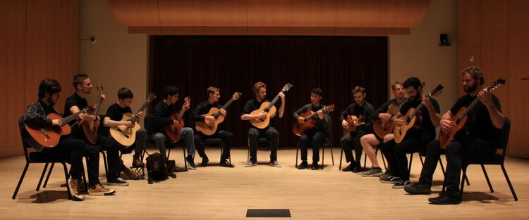 Group of people playing guitars 