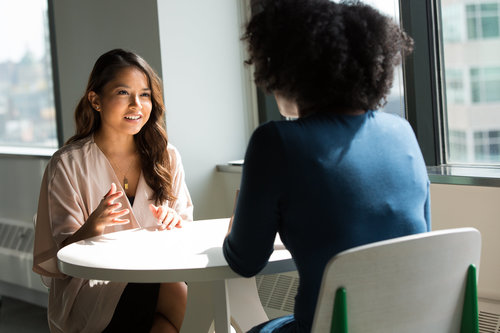 Two people in conversation 