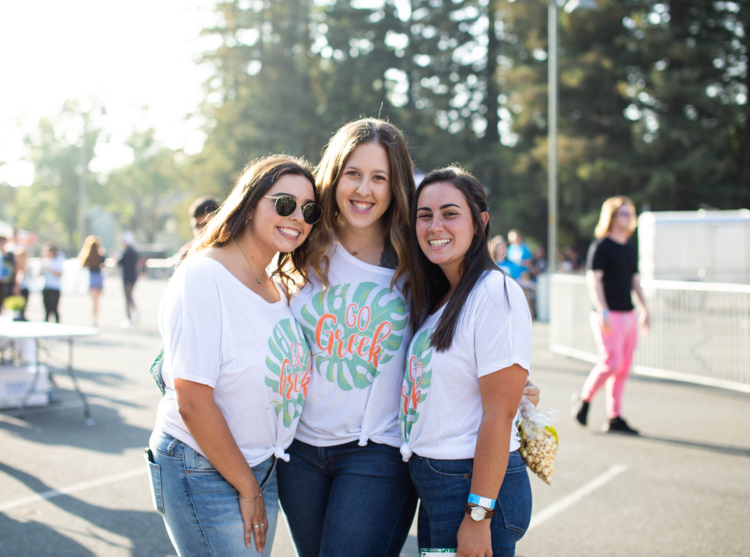 Three sorority members smiling 