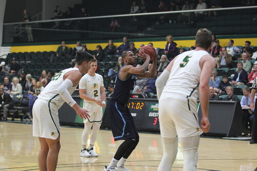 student playing basketball 