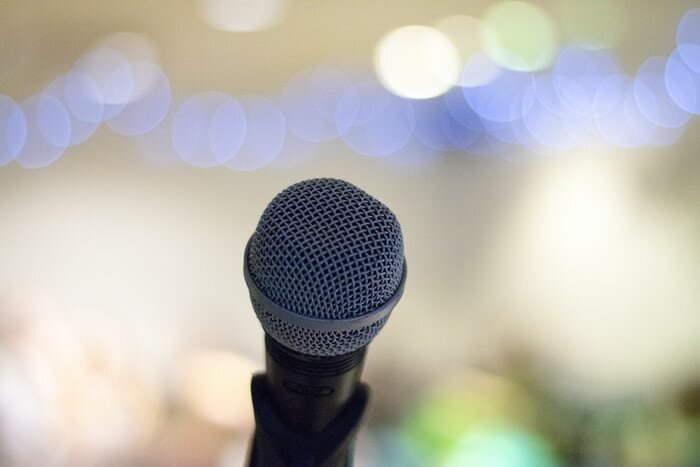 A microphone with colorful bokeh in the background