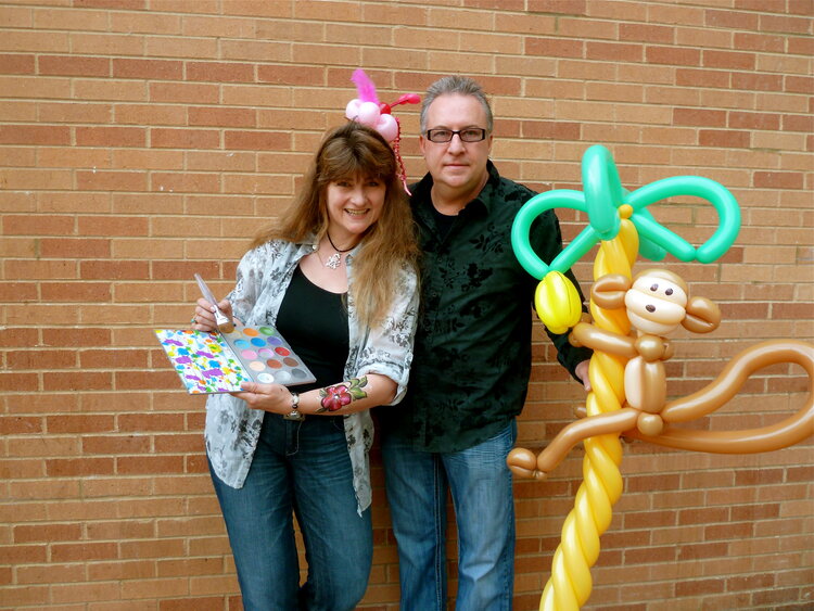 People posing with balloon animals 