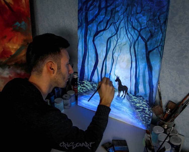 Someone painting a glow-in-the-dark image of a horse surrounded by trees