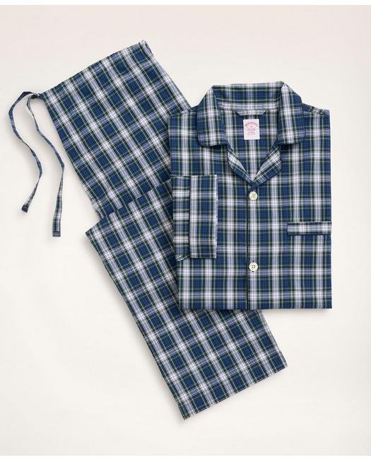 A set of folded plaid pajamas 