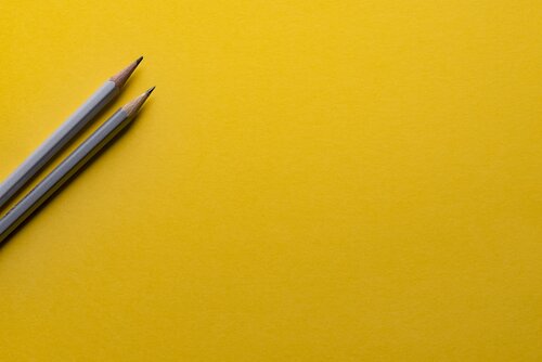 Pencils against a yellow backdrop 