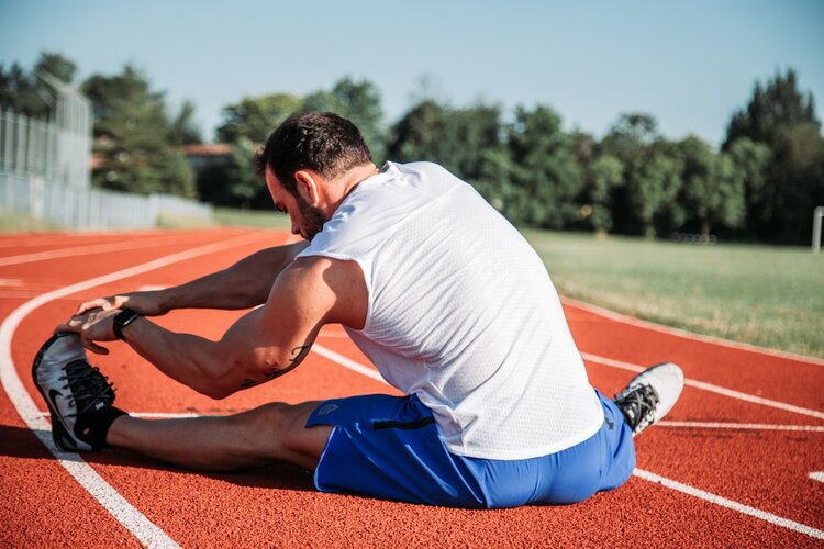 Track athlete stretching 