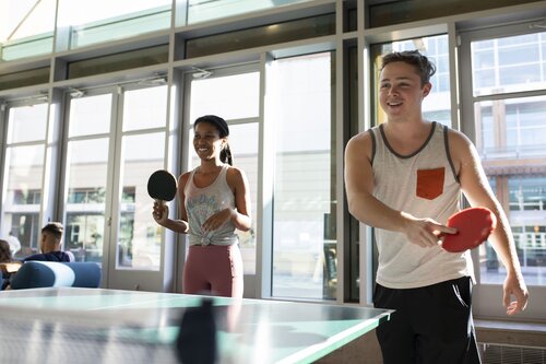 Students playing ping pong 