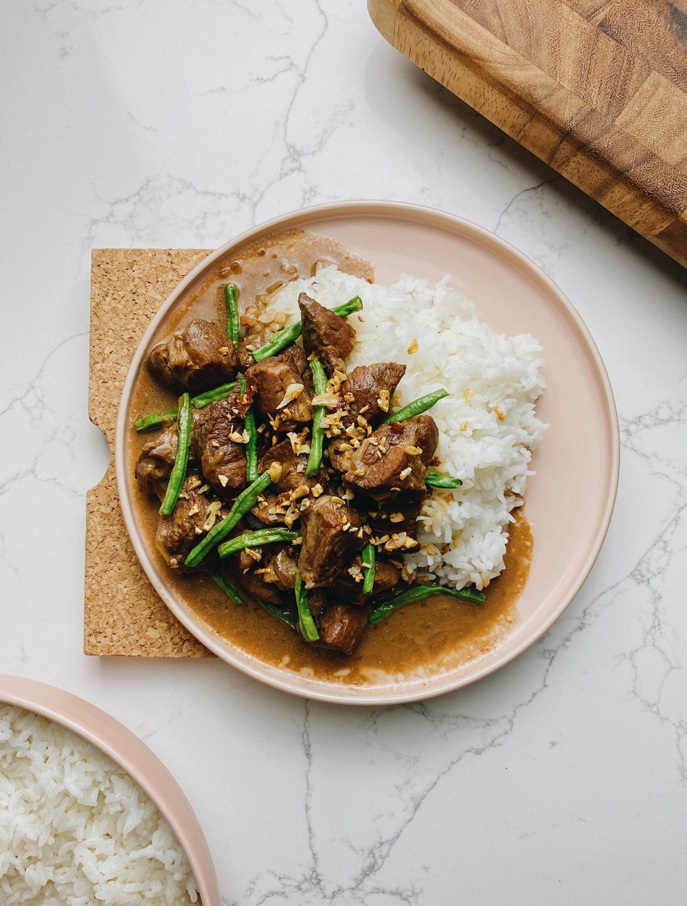 A plate of pork adobo with rice