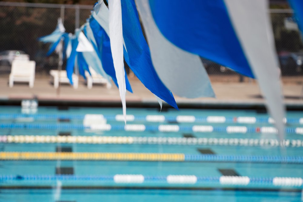 White and blue pool flags above the Athletics Pool