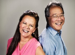 Yo-Yo Ma and Kathryn Stott posing together and smiling