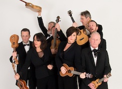 The members of the Ukulele Orchestra of Great Britain posing with their ukeleles