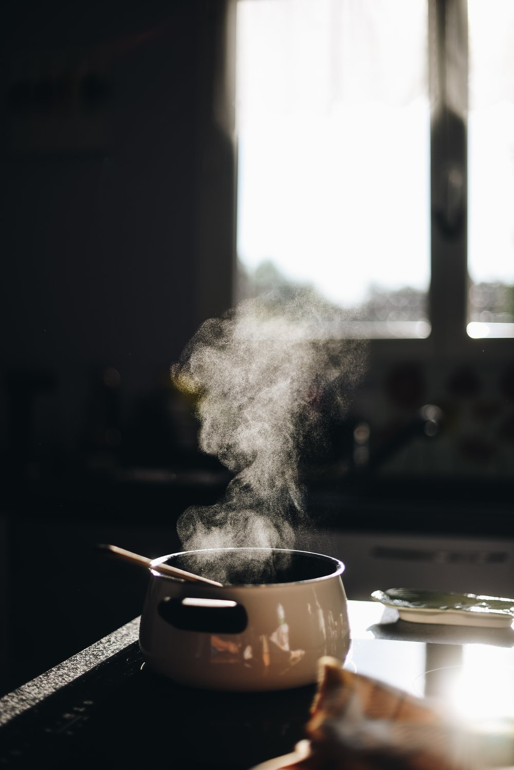 a pot cooking with smoke rising from it
