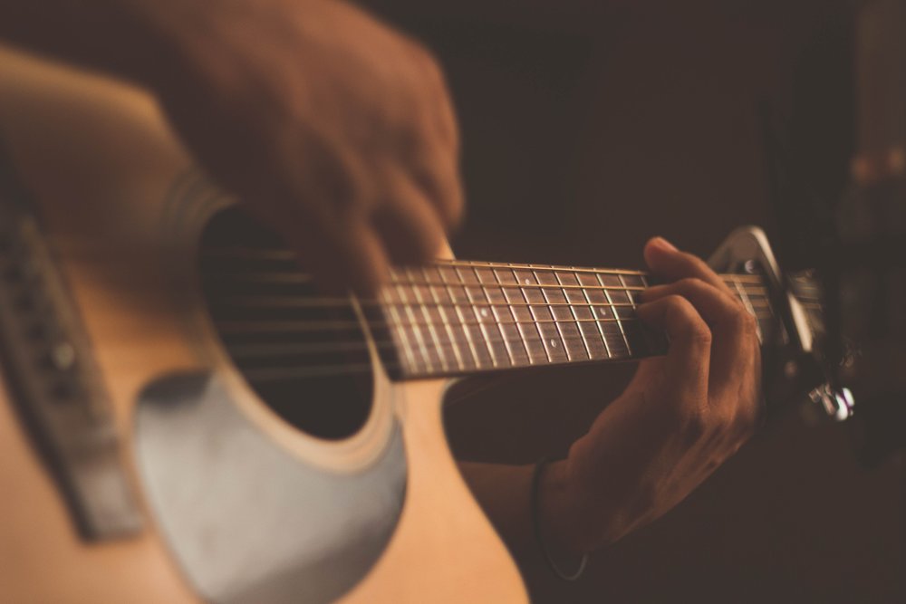 a person playing the guitar