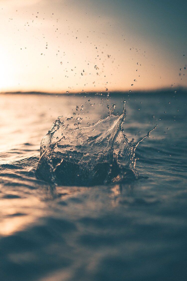 Water splashing in a large outdoor body of water 