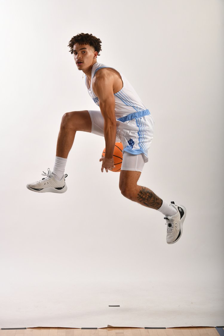 Sonoma State Men's Basketball player Julian Bryant dribbling a basketball between his legs