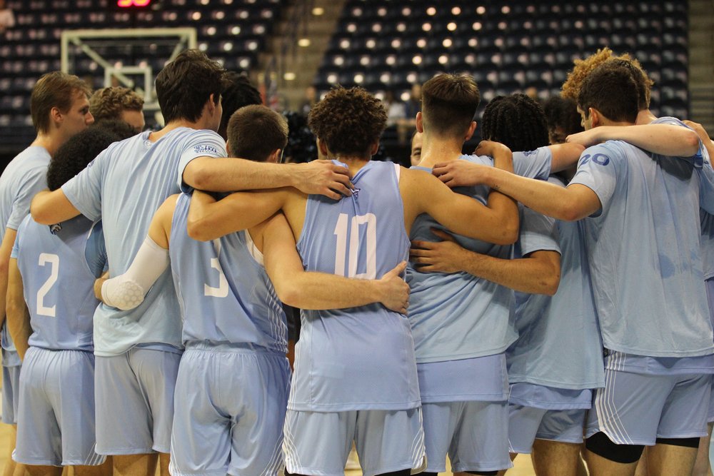 Sonoma State University's Men's Basketball team huddled up