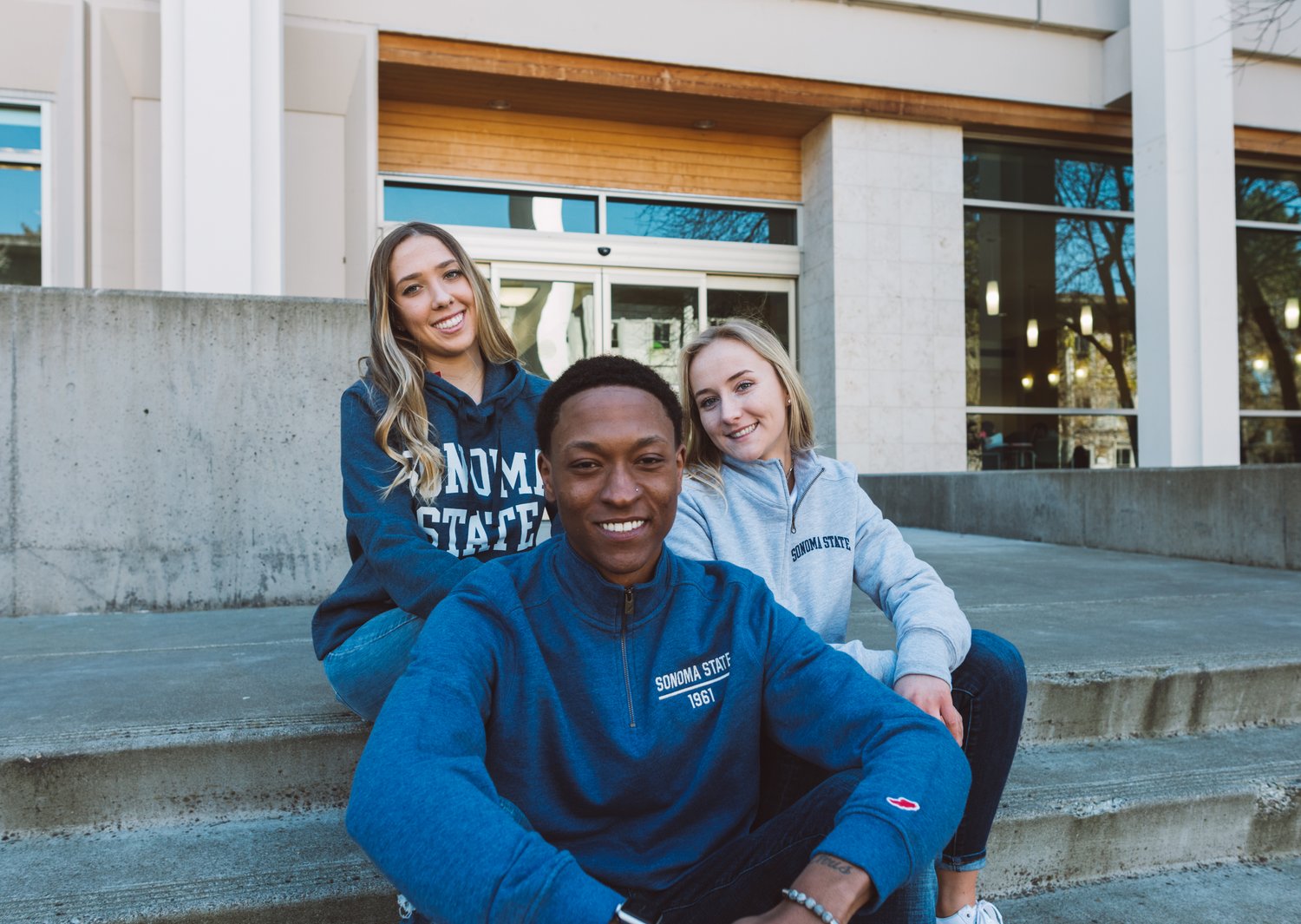 three SSU students showing their school pride by wearing SSU gear