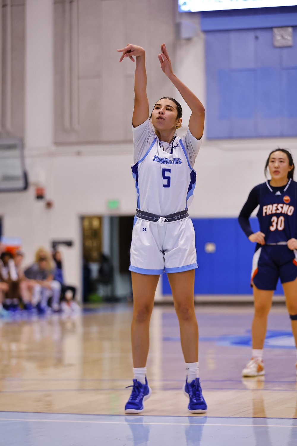 Sonoma State University Women's Basketball player Sienna Cherwinski shooting for the hoop