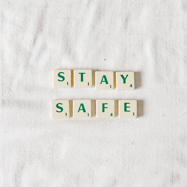 Scrabble pieces arranged to spell out "Stay Safe" 