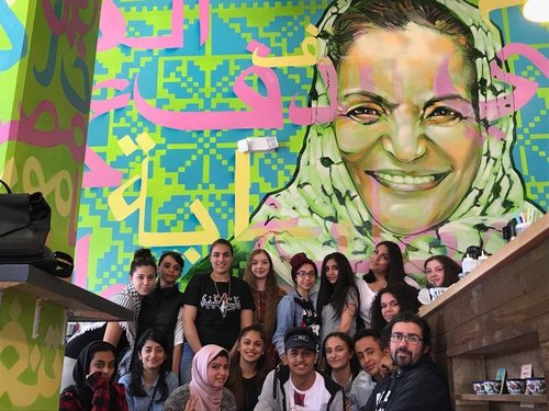 Students in front of a banner 