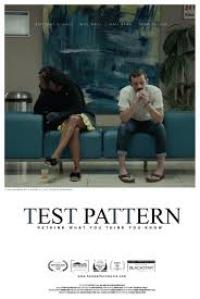 The 'Test Pattern' film poster featuring two people sitting indoors on a blue seat with paintings in the background