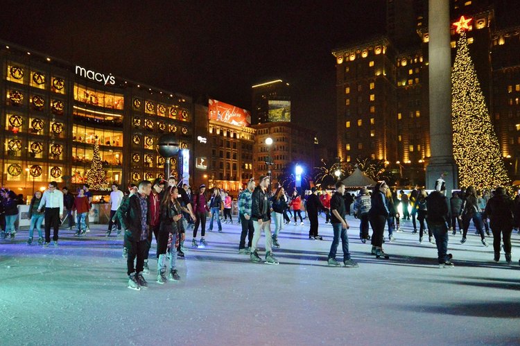 People ice skating at Union Square at night