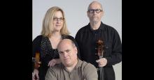 The three members of Veretski Pass posing with their instruments