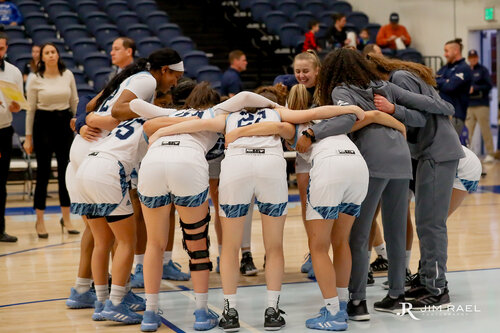 Volleyball team in a huddle 