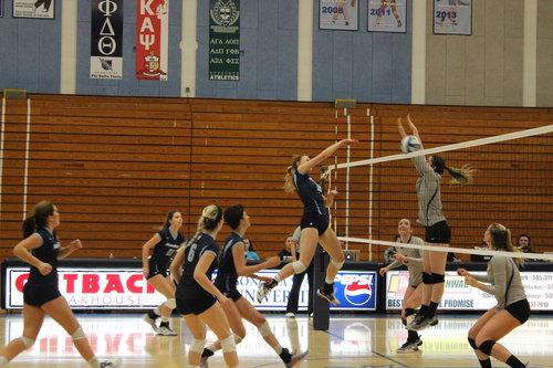 Students spiking the volleyball 