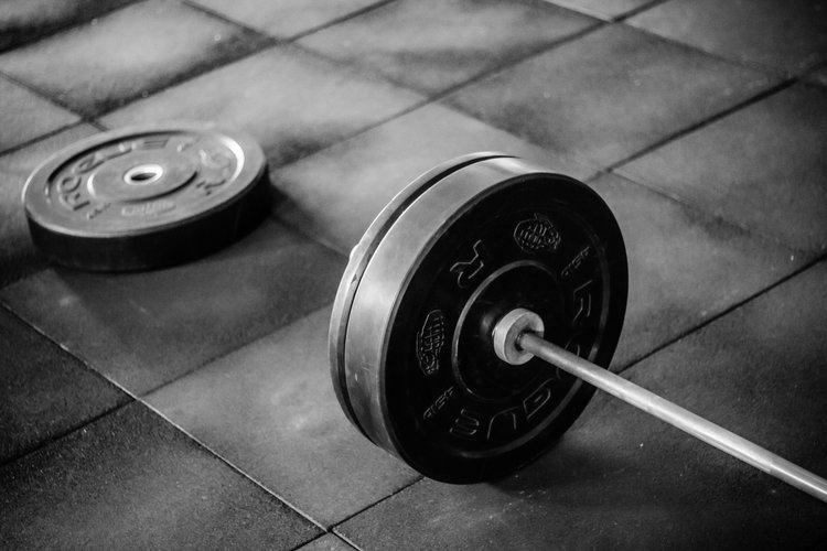 A black and white image of weightlifting weights