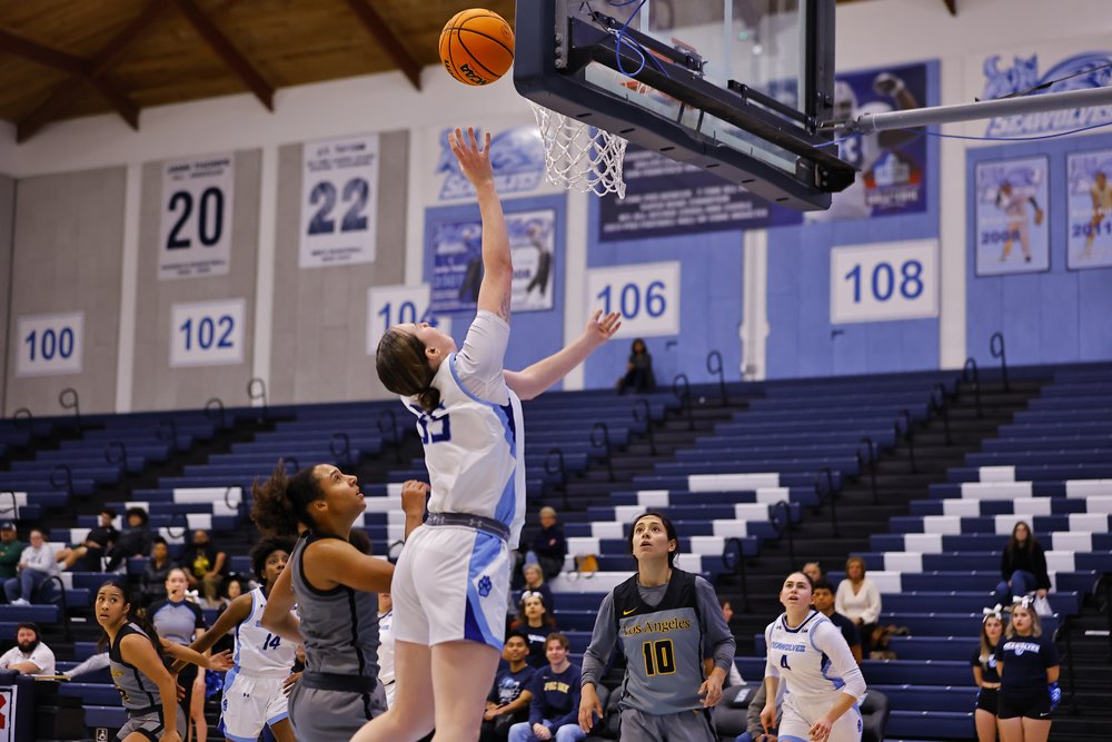 SSU Women's Basketball player Alli McDonald shooting the ball into the hoop