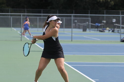 Student athlete playing tennis 