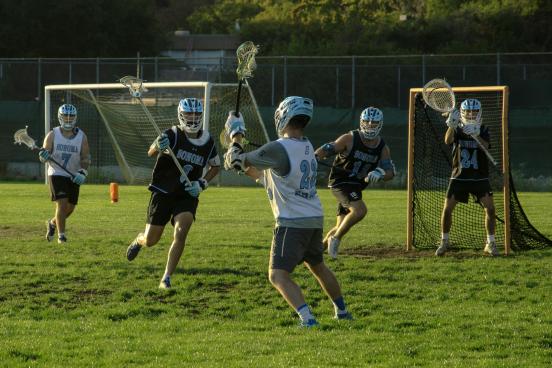 SSU Men's Lacrosse Team The SSU Men's Lacrosse team playing lacrosse on an outdoor field