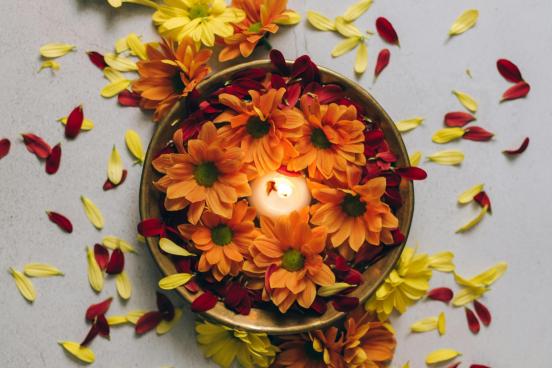 Diwali Candles and Flowers Colorful flower petals and tealights