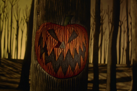 Halloween jack-o-lantern A Halloween jack-o-lantern carved into a tree