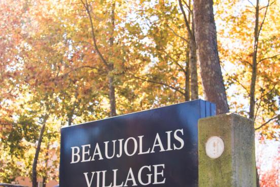 Beaujolais Village Sign An outdoor sign for Beaujolais Village