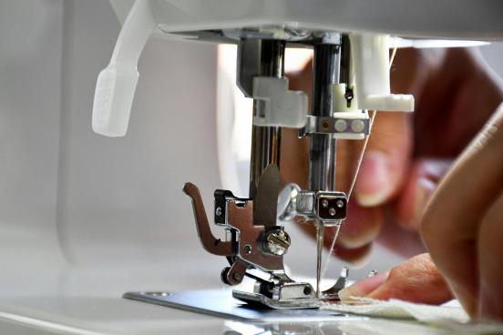 Sewing Machine Someone using a sewing machine