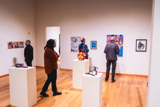 Gallery visitors view student art