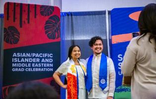 Students smiling and posing for a picture at AAPI Graduation