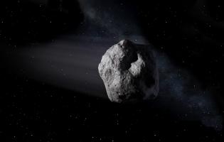 an asteroid flying through space
