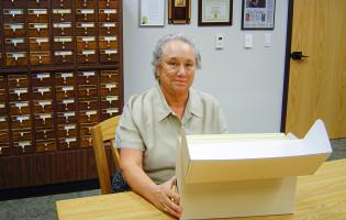 Gaye LeBaron sits in front of the Press Democrat's card catalog
