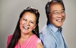 Yo-Yo Ma and Kathryn Stott posing together and smiling