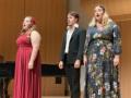Three members of the Vocal Repertory Class singing Bernstein Songs on stage