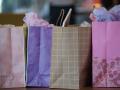 A row of colorful and patterned gift bags 