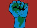A graphic illustration of a raised fist with earth's continents inside of it