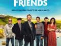 The film poster for 'Fisherman's Friends' featuring a line of 6 people posing in front of an outdoor landscape